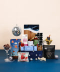 Celebrate and Cheer celebration gift box with resin charcuterie board, champagne popcorn, olive tapenade and festive treats from Canadian small businesses