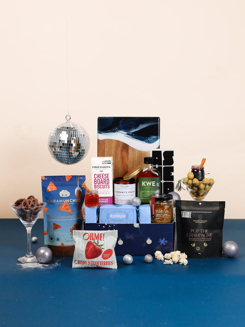 Celebrate and Cheer celebration gift box with resin charcuterie board, champagne popcorn, olive tapenade and festive treats from Canadian small businesses
