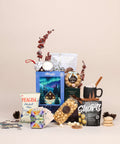 Home for the Holidays family gift box with cabin puzzle, shortbread cookie mix, peppermint hot chocolate and caramel corn from Canadian small businesses